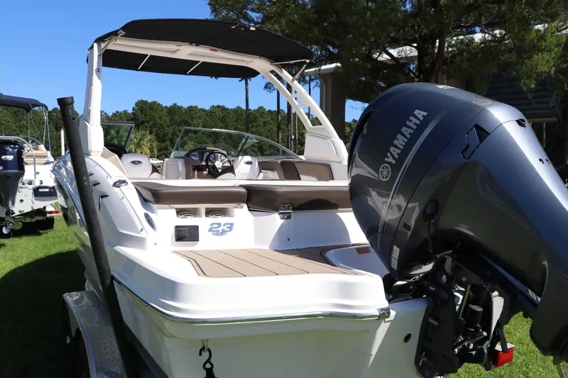 Slide: The Image of 2021 Chaparral 23 SSi OB boat with Yamaha outboard engine, displayed outdoors. - 3