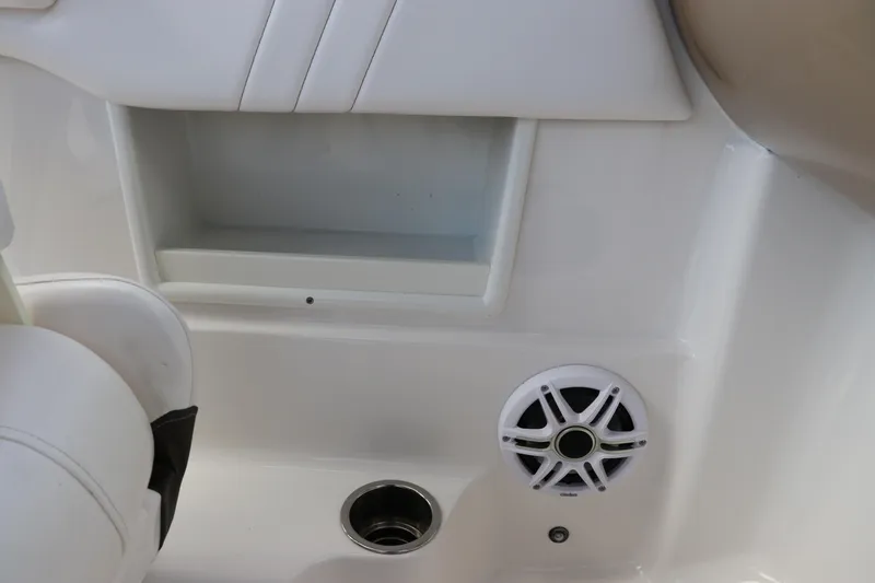 Slide: The Image of 2021 Chaparral 23 SSi OB boat interior with speaker and storage compartment. - 39