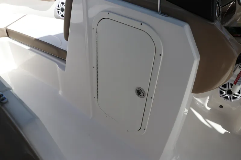 Slide: The Image of 2021 Chaparral 23 SSi OB boat interior with storage compartment and seating. - 47