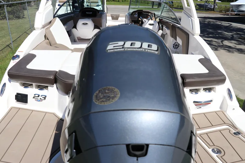 Slide: The Image of 2021 Chaparral 23 SSi OB boat with 200 horsepower engine, featuring spacious seating. - 5