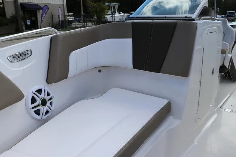 Slide: The Image of 2021 Chaparral 23 SSi OB boat interior with cushioned seating and speaker. - 52