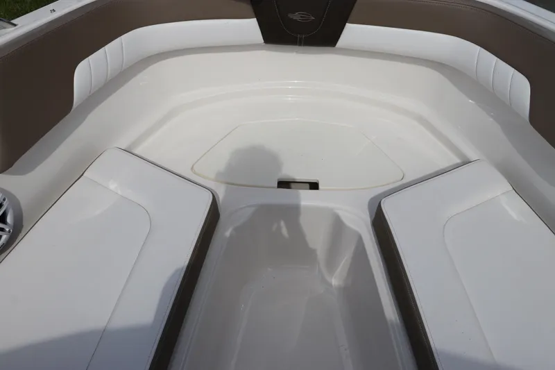 Slide: The Image of Interior seating of 2021 Chaparral 23 SSi OB boat, featuring white and brown upholstery. - 54
