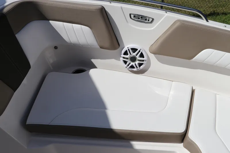 Slide: The Image of 2021 Chaparral 23 SSi OB boat interior with cushioned seating and speaker. - 56