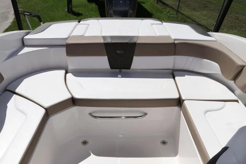 Slide: The Image of 2021 Chaparral 23 SSi OB boat interior with cushioned seating and sleek design. - 6