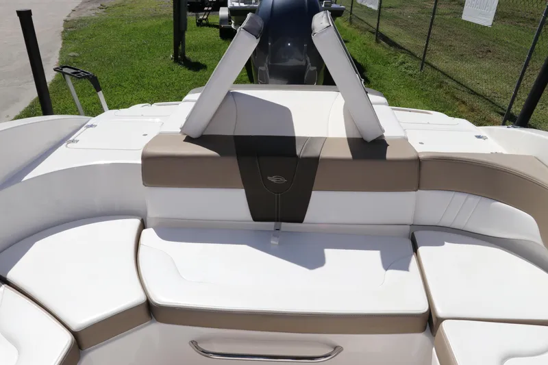 Slide: The Image of 2021 Chaparral 23 SSi OB boat interior with beige and white seating. - 7