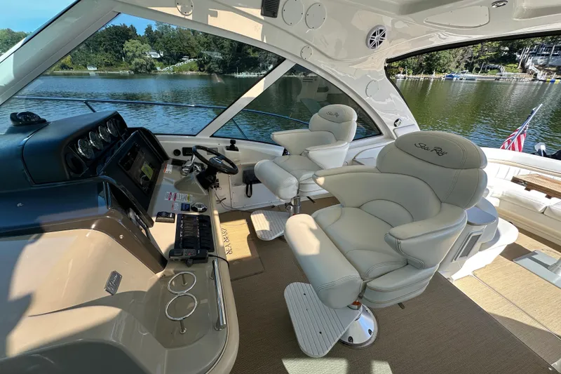 Slide: The Image of Luxurious 2009 Sea Ray 48 Sundancer yacht interior with plush seating and scenic lake view. - 10