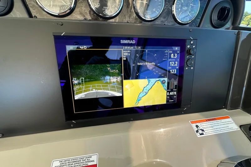 Slide: The Image of Simrad navigation display on 2009 Sea Ray 48 Sundancer yacht dashboard. - 12