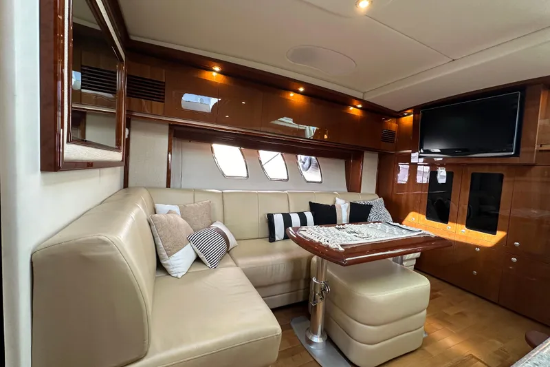 Slide: The Image of Luxurious interior of 2009 Sea Ray 48 Sundancer yacht with plush seating and elegant decor. - 16