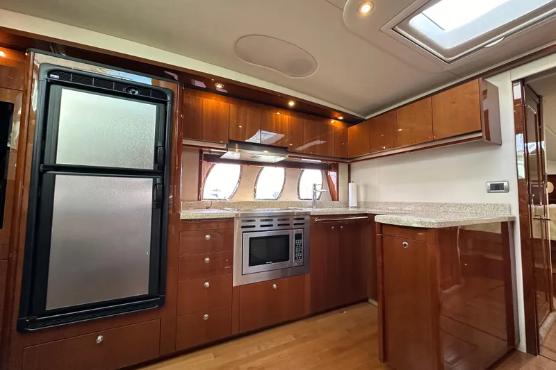 Slide: The Image of Luxurious kitchen interior of 2009 Sea Ray 48 Sundancer yacht with modern appliances. - 17