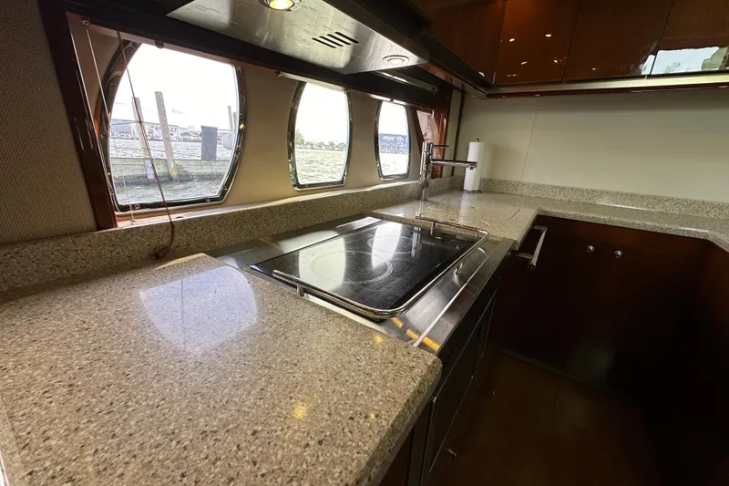 Slide: The Image of Luxurious kitchen interior of 2009 Sea Ray 48 Sundancer yacht with modern amenities. - 22