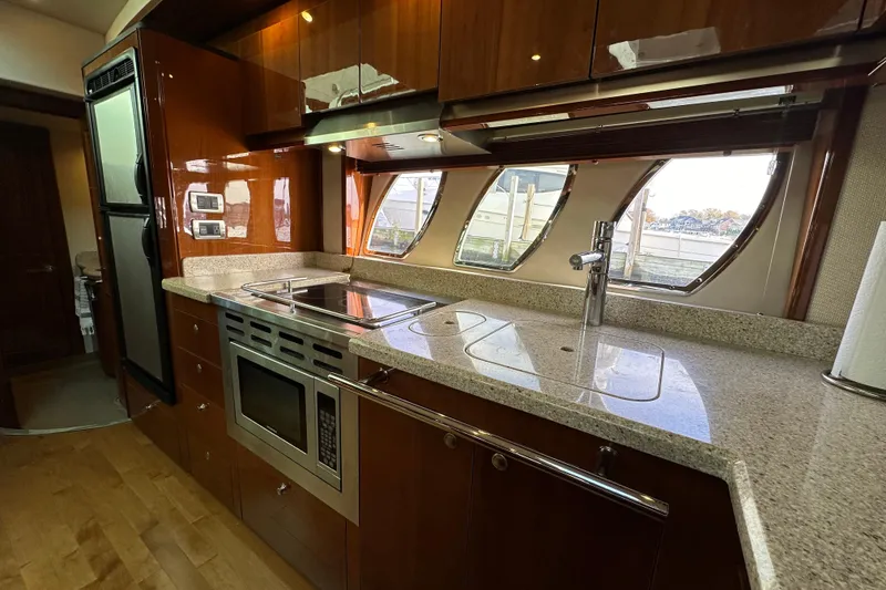 Slide: The Image of Luxurious kitchen interior of 2009 Sea Ray 48 Sundancer yacht with modern appliances. - 23