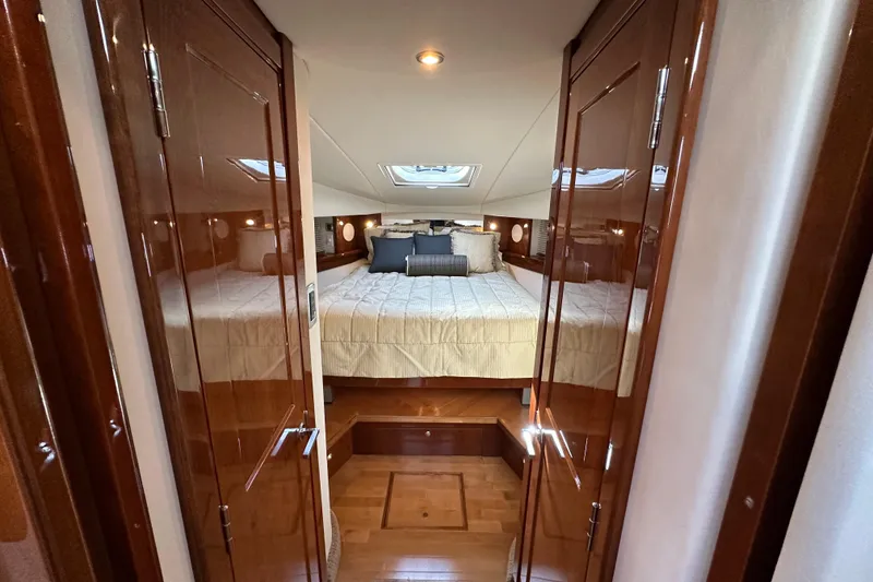 Slide: The Image of Luxurious cabin interior of 2009 Sea Ray 48 Sundancer yacht with elegant wood finish. - 24