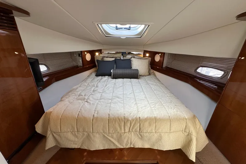 Slide: The Image of Luxurious cabin interior of 2009 Sea Ray 48 Sundancer yacht with plush bedding. - 25