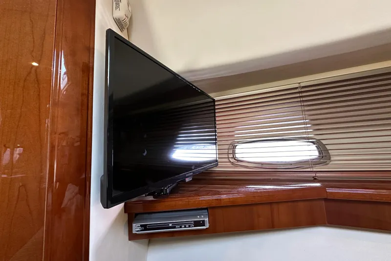 Slide: The Image of Flat-screen TV and DVD player in 2009 Sea Ray 48 Sundancer yacht interior. - 28