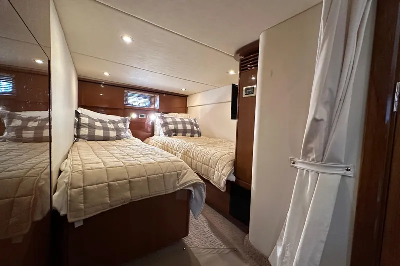 Slide: The Image of Luxurious twin cabin interior of 2009 Sea Ray 48 Sundancer yacht. - 32