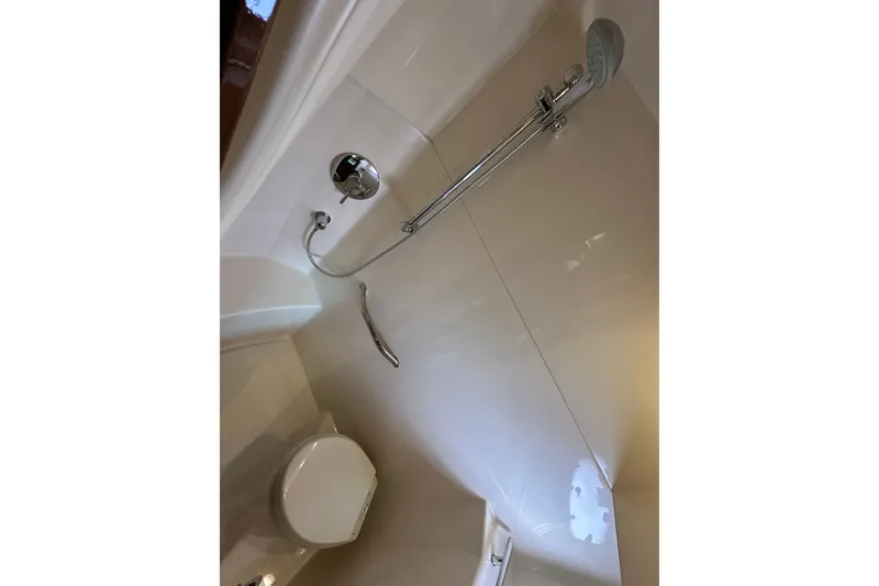 Slide: The Image of Bathroom interior of 2009 Sea Ray 48 Sundancer yacht, featuring shower and toilet. - 37