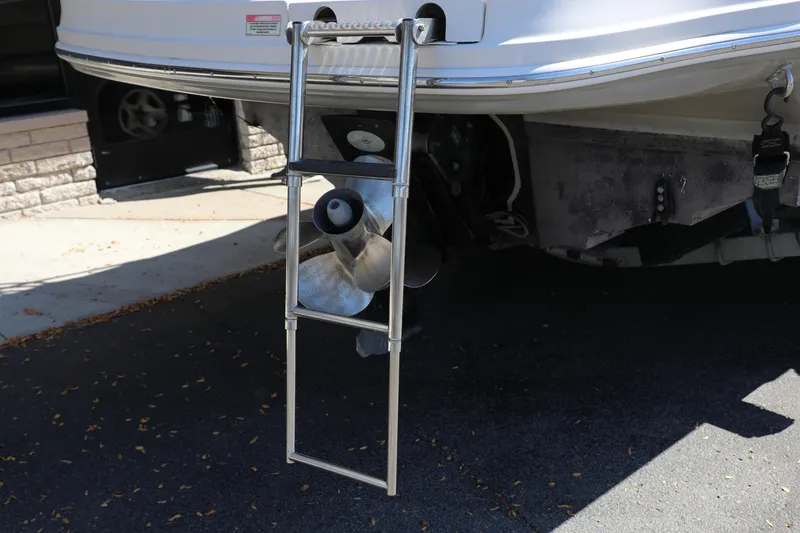 Slide: The Image of Rear view of 2008 Sea Ray 220 Sundeck with ladder and propeller visible. - 10