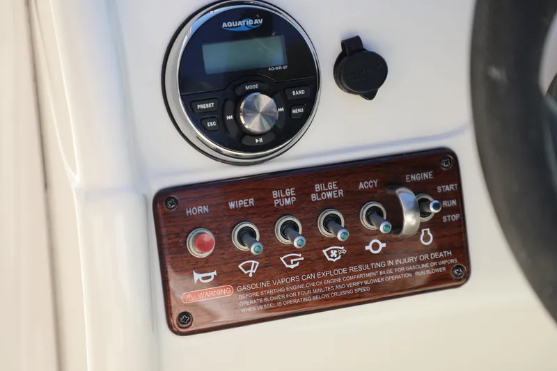 Slide: The Image of Control panel of a 2008 Sea Ray 220 Sundeck boat with switches and stereo system. - 20