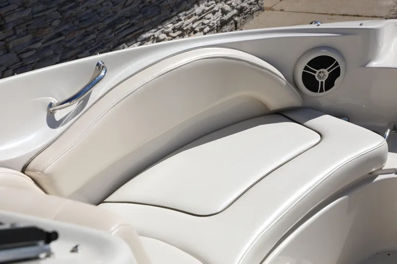 Slide: The Image of 2008 Sea Ray 220 Sundeck interior seating with speaker and handle detail. - 25