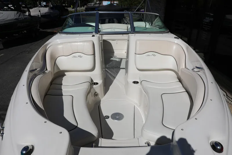 Slide: The Image of 2008 Sea Ray 220 Sundeck boat interior with white seating and open deck layout. - 4