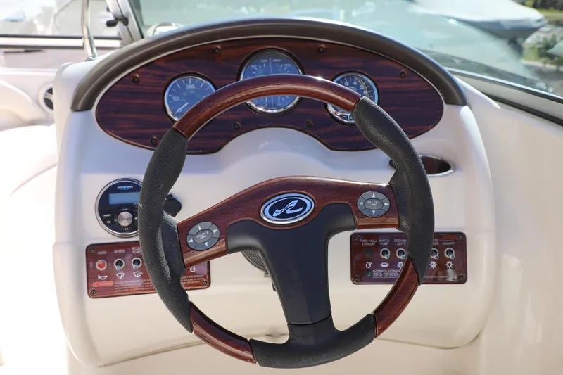 Slide: The Image of Steering wheel and dashboard of 2008 Sea Ray 220 Sundeck boat. - 5