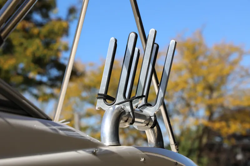 Slide: The Image of Close-up of a 2008 Sea Ray 220 Sundeck boat's wakeboard rack against a clear sky. - 9