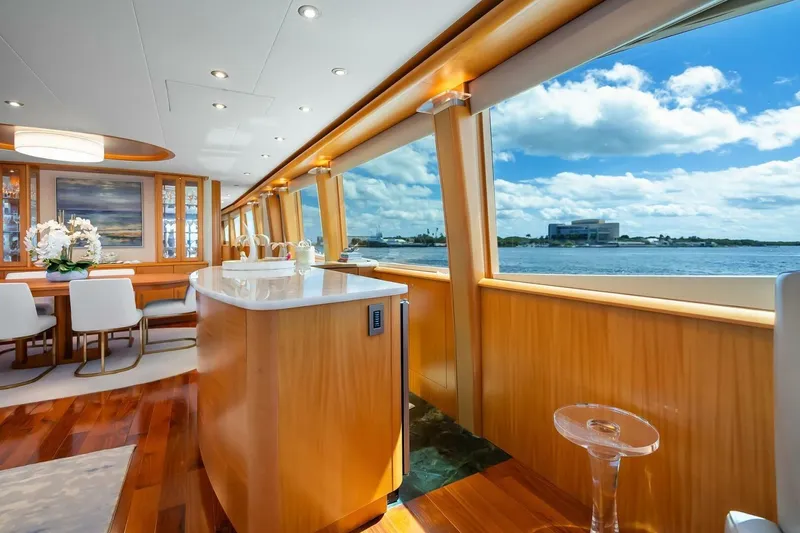 Slide: The Image of Luxurious 2008 Lazzara Motor Yacht interior with elegant dining area and scenic ocean view. - 14