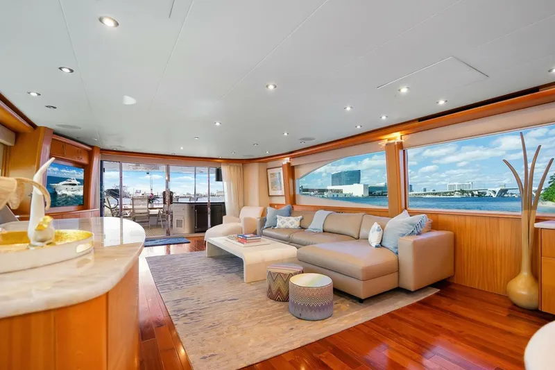 Slide: The Image of Luxurious 2008 Lazzara Motor Yacht interior with elegant seating and panoramic windows. - 15