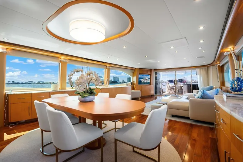 Slide: The Image of Luxurious interior of a 2008 Lazzara motor yacht with elegant dining and seating area. - 16