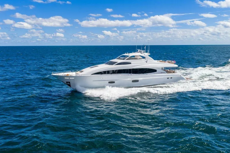 Slide: The Image of 2008 Lazzara Motor Yacht cruising on open ocean under clear blue sky. - 2