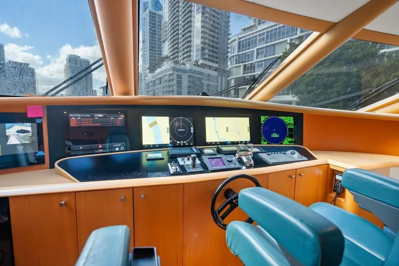 Slide: The Image of Control panel of a 2008 Lazzara Motor Yacht with cityscape view. - 22