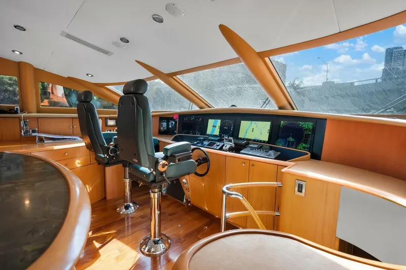 Slide: The Image of Luxurious 2008 Lazzara motor yacht helm with modern navigation equipment and leather seating. - 23