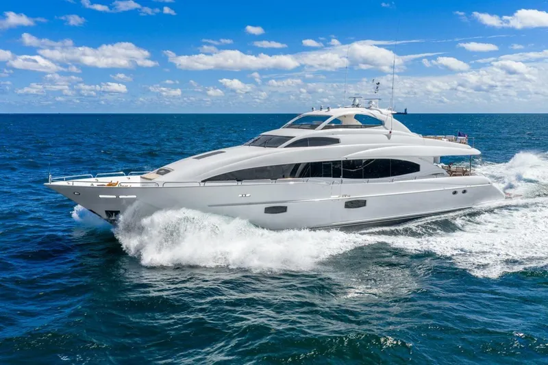 Slide: The Image of 2008 Lazzara Motor Yacht cruising on open sea under clear blue sky. - 3