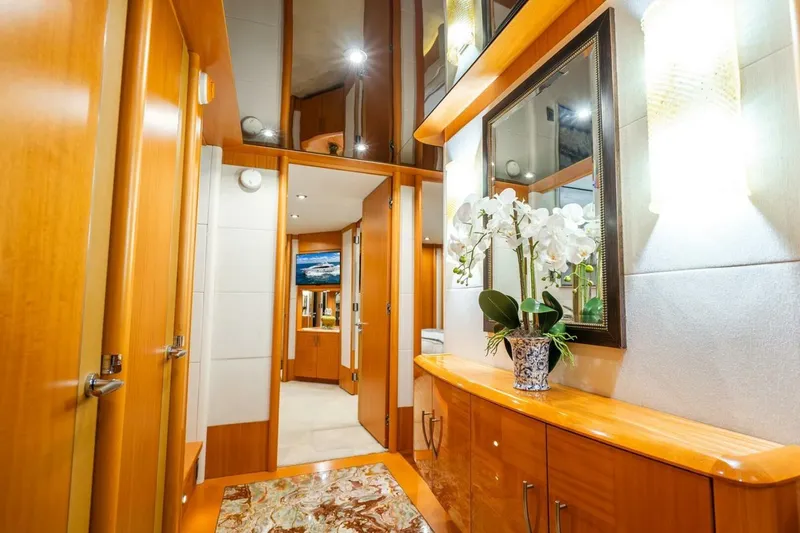 Slide: The Image of Luxurious interior of a 2008 Lazzara motor yacht with elegant wood finishes and floral decor. - 34