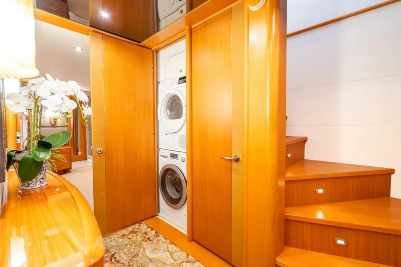 Slide: The Image of Luxurious 2008 Lazzara Motor Yacht interior with wooden cabinetry and laundry area. - 35