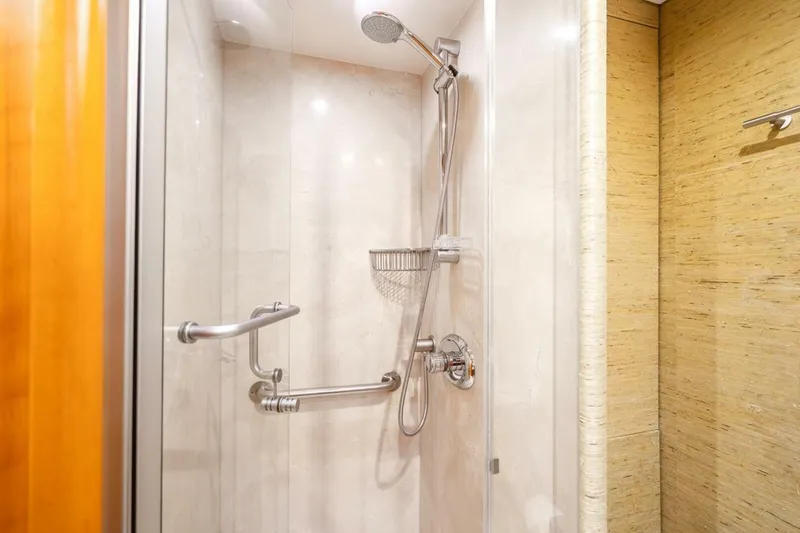 Slide: The Image of Shower area in a 2008 Lazzara motor yacht, featuring modern fixtures and grab bars. - 45