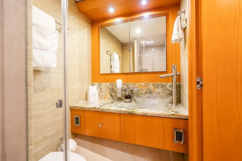 Slide: The Image of Luxurious bathroom on a 2008 Lazzara motor yacht with elegant wood finishes and modern fixtures. - 46
