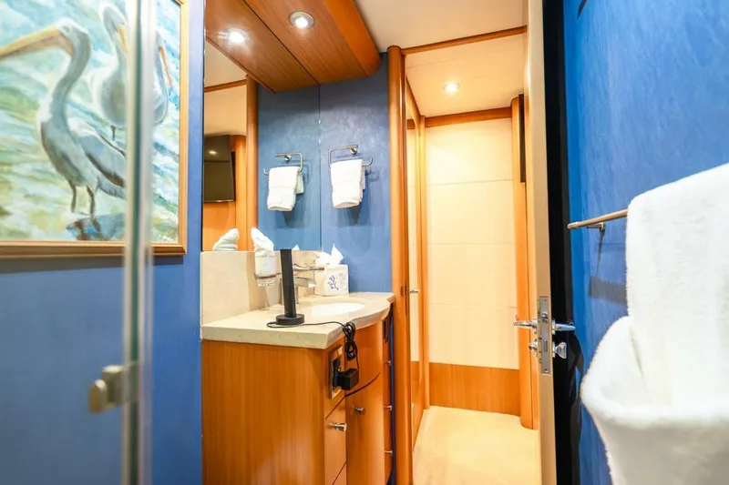 Slide: The Image of Luxurious bathroom in 2008 Lazzara Motor Yacht with blue walls and elegant fixtures. - 51