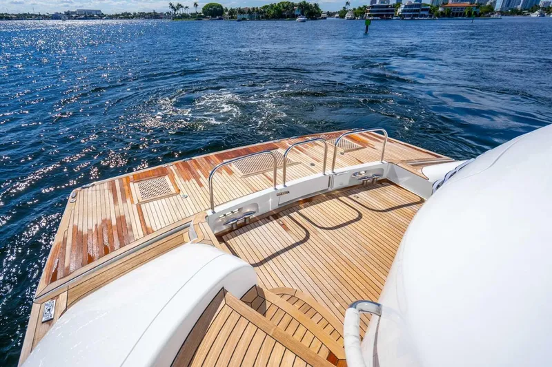 Slide: The Image of Luxurious 2008 Lazzara Motor Yacht with elegant wooden deck on serene water. - 57