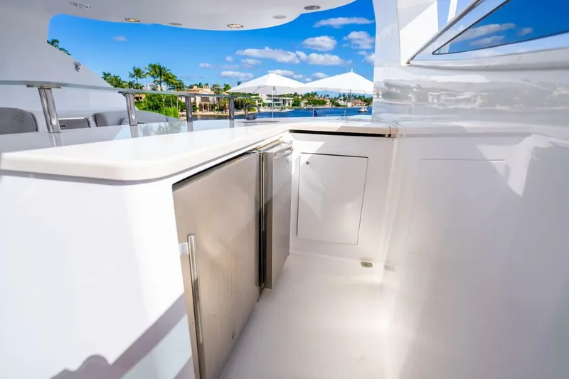 Slide: The Image of Luxurious 2008 Lazzara Motor Yacht with sleek outdoor kitchen and stunning waterfront view. - 66