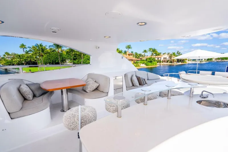 Slide: The Image of Luxurious 2008 Lazzara Motor Yacht deck with elegant seating and scenic waterfront view. - 67