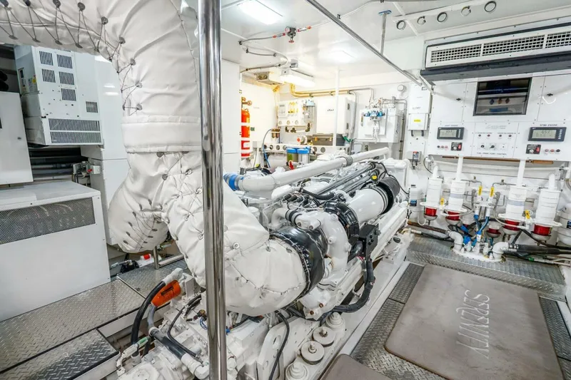 Slide: The Image of Engine room of a 2008 Lazzara Motor Yacht, showcasing advanced machinery and control systems. - 75