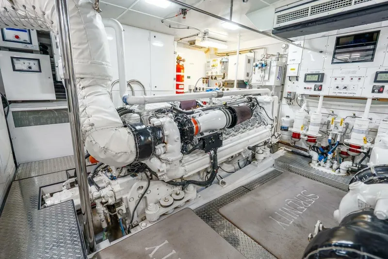 Slide: The Image of Engine room of a 2008 Lazzara Motor Yacht, featuring advanced machinery and control panels. - 80