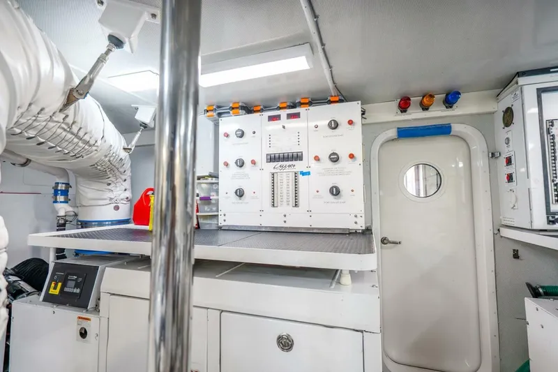 Slide: The Image of Engine room of 2008 Lazzara Motor Yacht with control panels and equipment. - 84