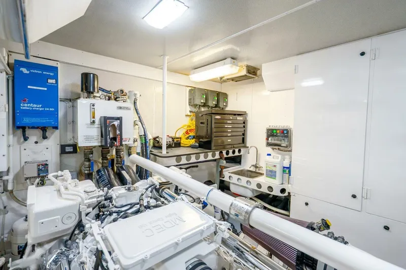 Slide: The Image of Engine room of a 2008 Lazzara Motor Yacht with modern equipment and organized layout. - 85