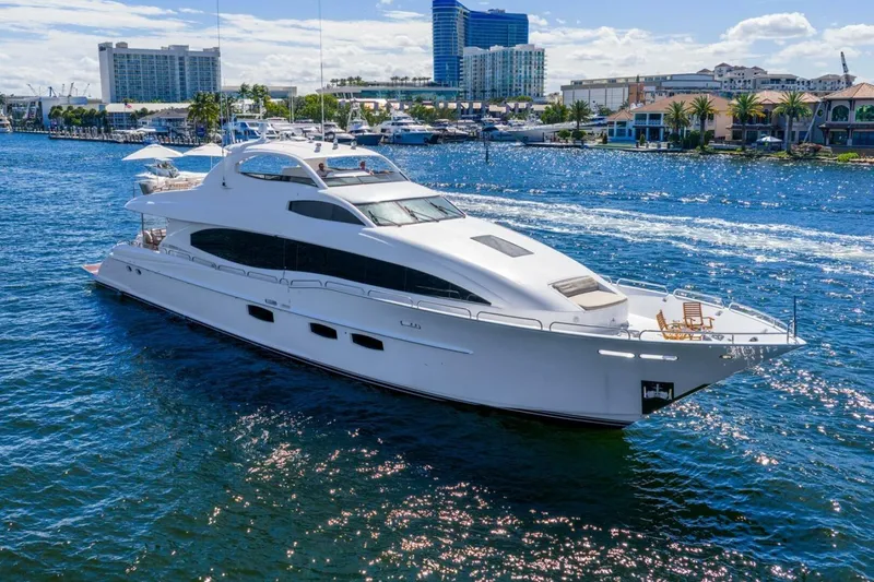 Slide: The Image of 2008 Lazzara Motor Yacht cruising on a sunny day in a marina setting. - 9