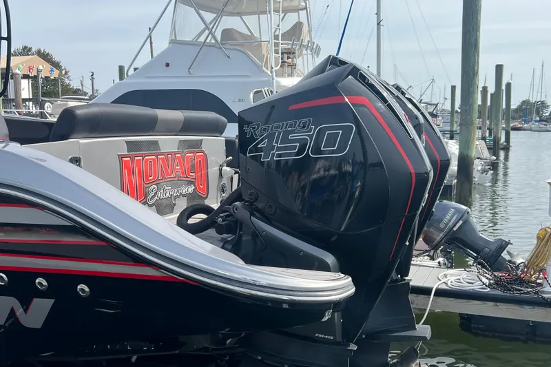 Slide: The Image of 2021 Fountain 39 NX boat with powerful Racing 450 engine at marina. - 11