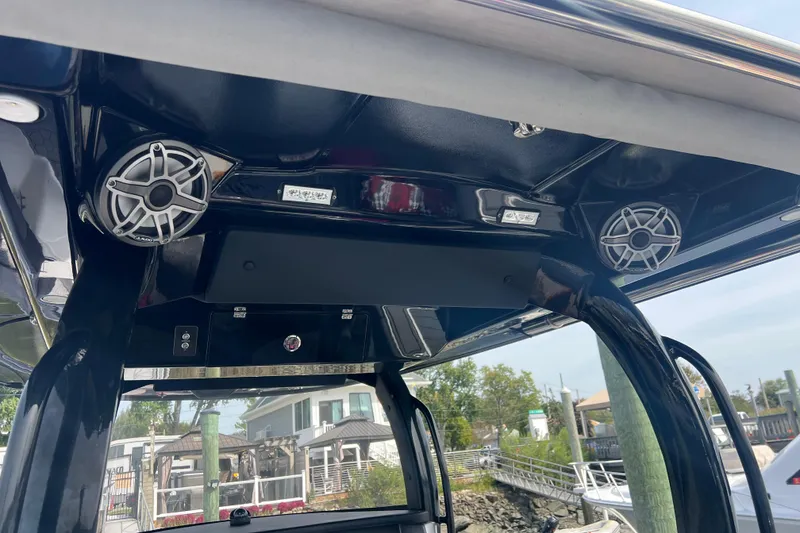 Slide: The Image of 2021 Fountain 39 NX boat interior with speakers and control panel. - 14