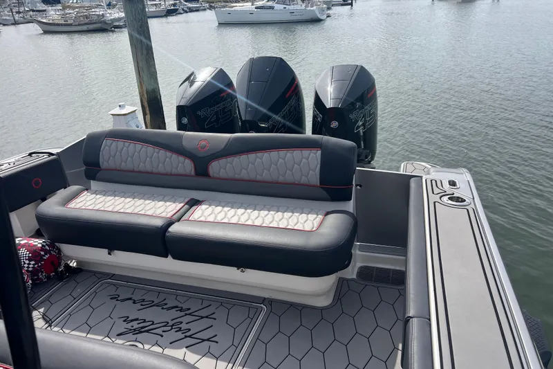 Slide: The Image of 2021 Fountain 39 NX boat with luxurious seating and powerful outboard engines. - 15