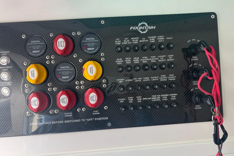 Slide: The Image of Control panel of a 2021 Fountain 39 NX boat with switches and relays. - 17